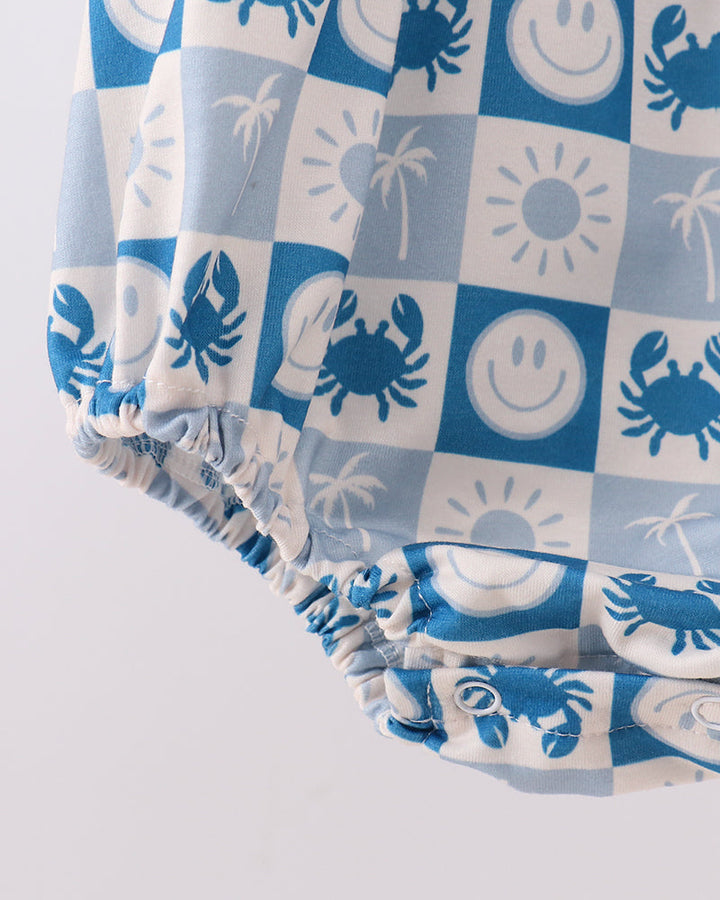 Blue-and-white checkered bubble romper with gathered ruffle legs and crab print