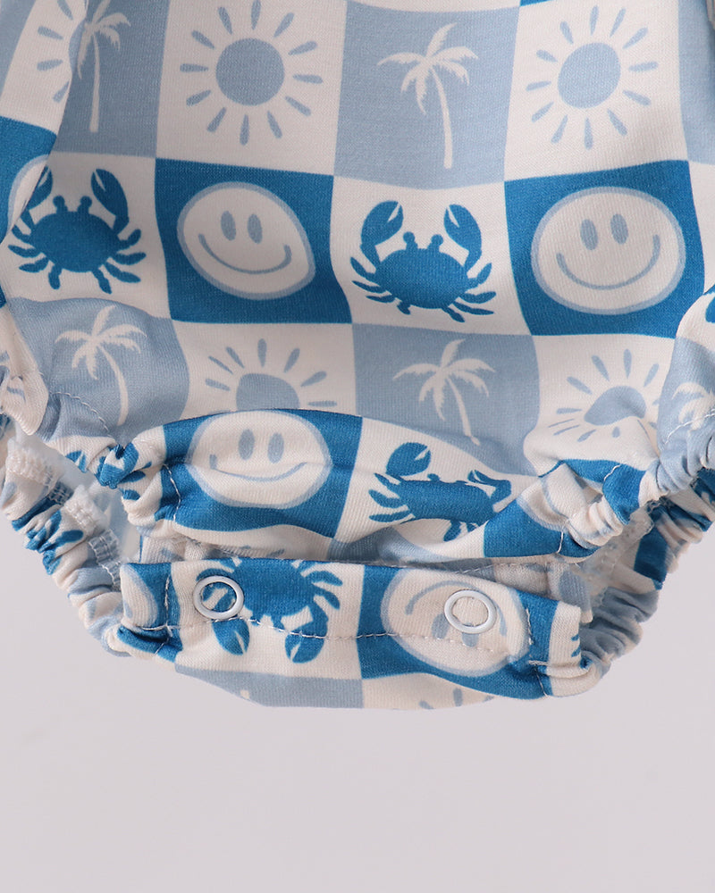 Gathered ruffle leg cuffs on blue-and-white checkered bubble romper