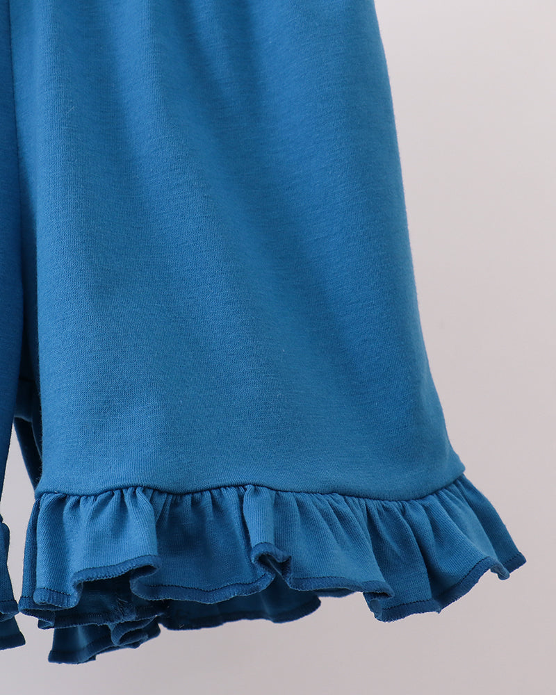 Solid blue shorts with elastic waist and flutter ruffle hem
