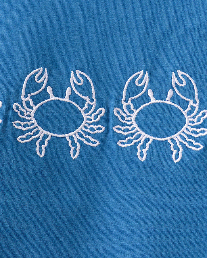 Blue T-shirt with white crab embroidery on chest