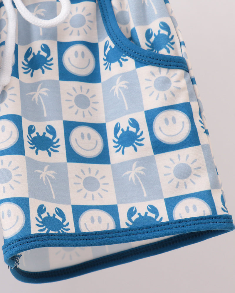 Checkered shorts hem with blue trim and crab, sun, and smiley icons