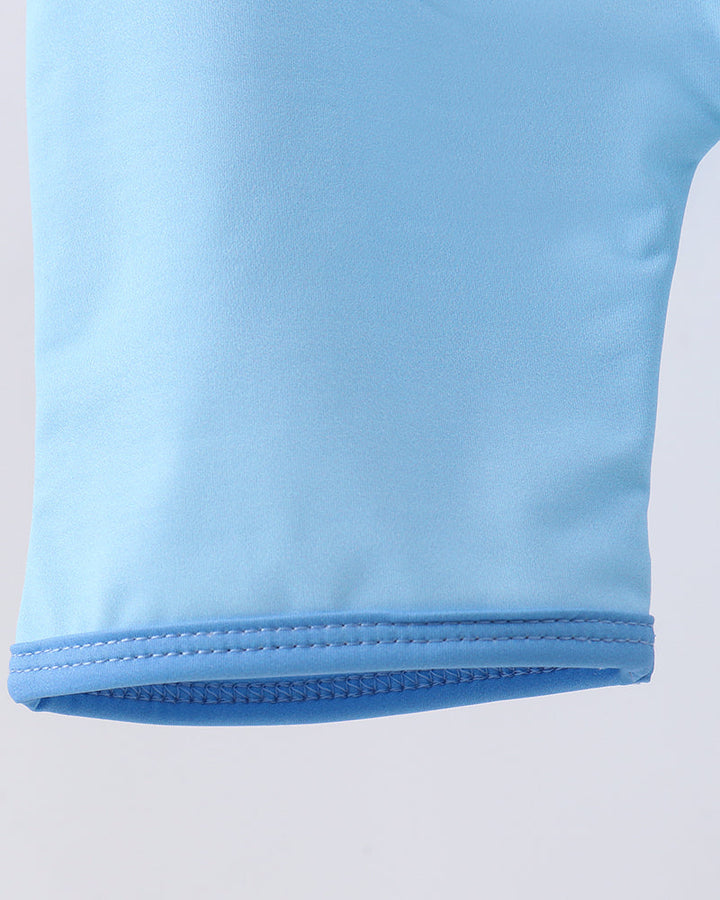 Close-up of a light blue fabric with a white background
