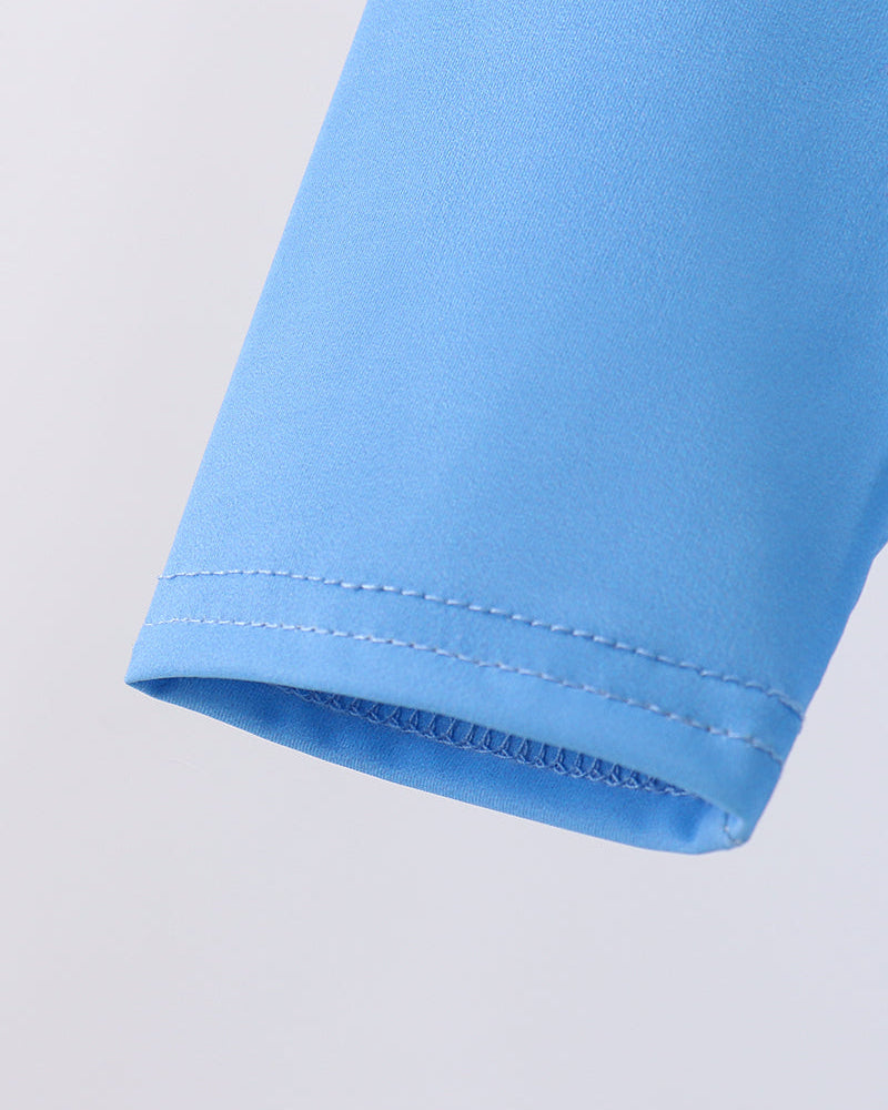 Close-up of a blue sleeve with a light gray background