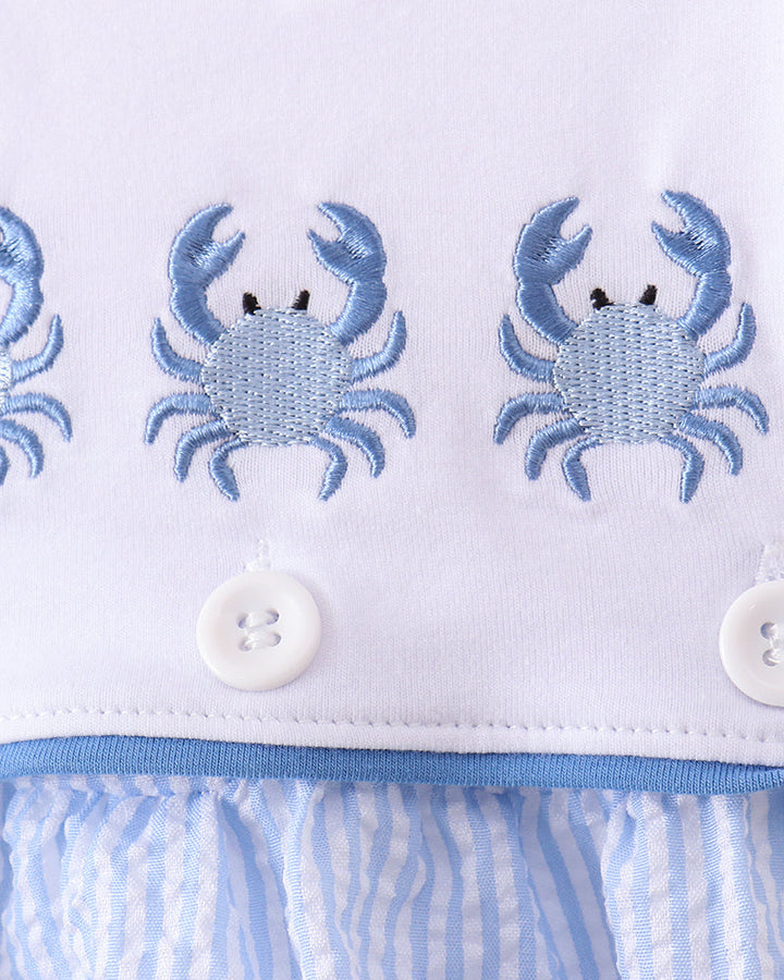 Blue romper with crab embroidery