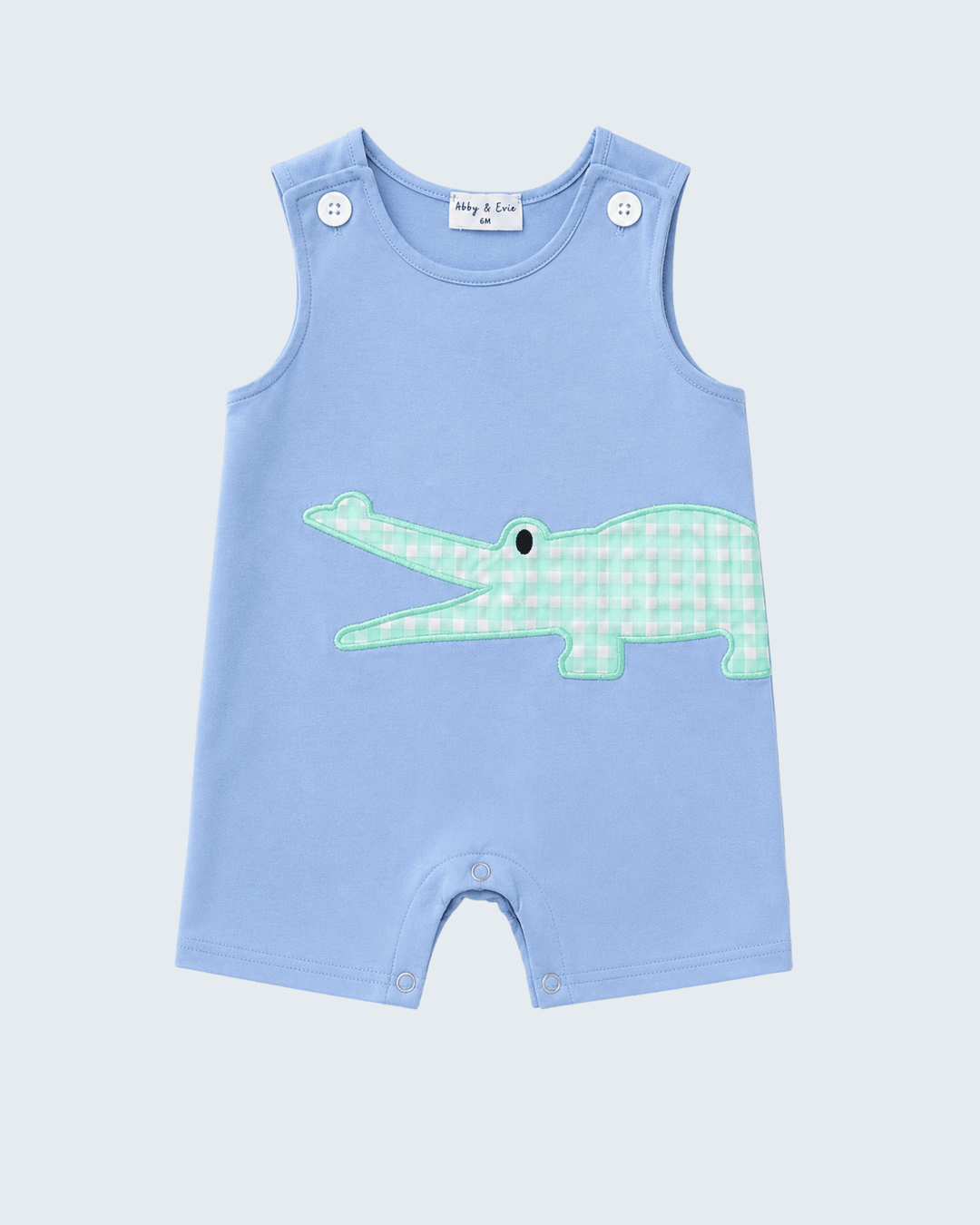 A light blue sleeveless baby romper with a green and white gingham crocodile applique on the front, shown flat against a light gray background.