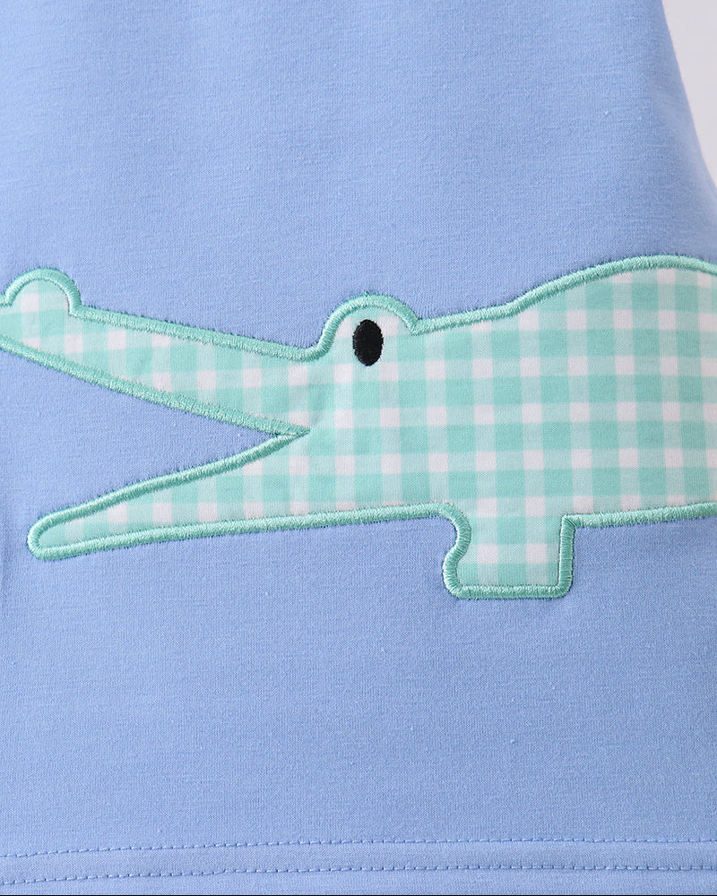 Light blue T-shirt with green plaid crocodile applique and stitched details