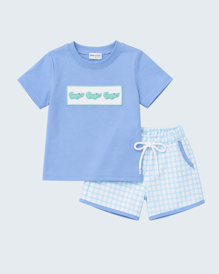 Light blue T-shirt with crocodile graphic and matching checkered shorts