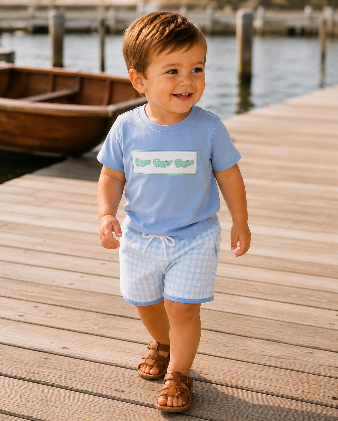 Toddler wearing a light blue T-shirt and blue-trim checkered shorts set