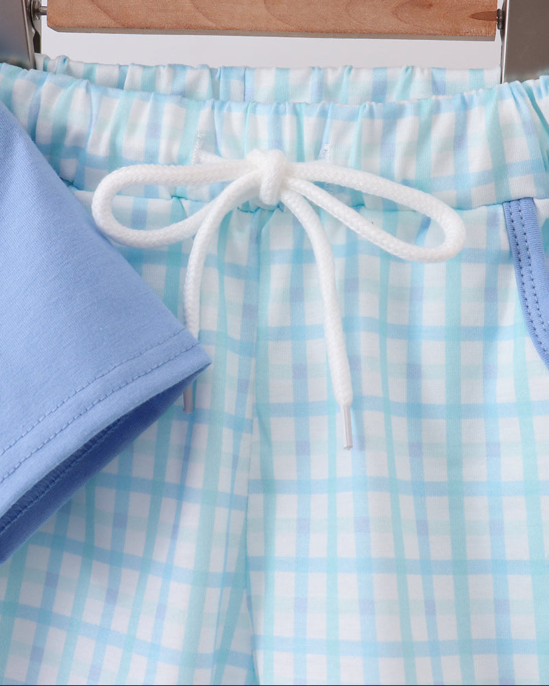 Light blue checkered shorts with white drawstring and blue trim