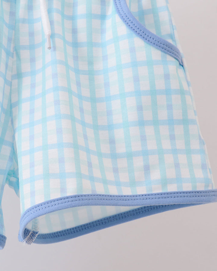Light blue checkered shorts with elastic waist and blue hem trim