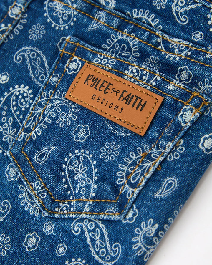 Girls denim jeans waist patch label on blue with white paisley print