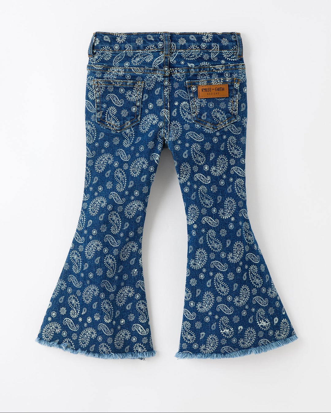 Girls blue denim bell-bottom jeans with white paisley print and back pocket label patch
