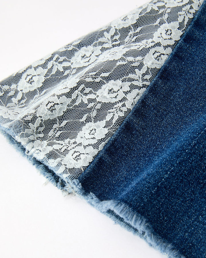 Denim bell-bottom hem with white lace lining and scalloped edge