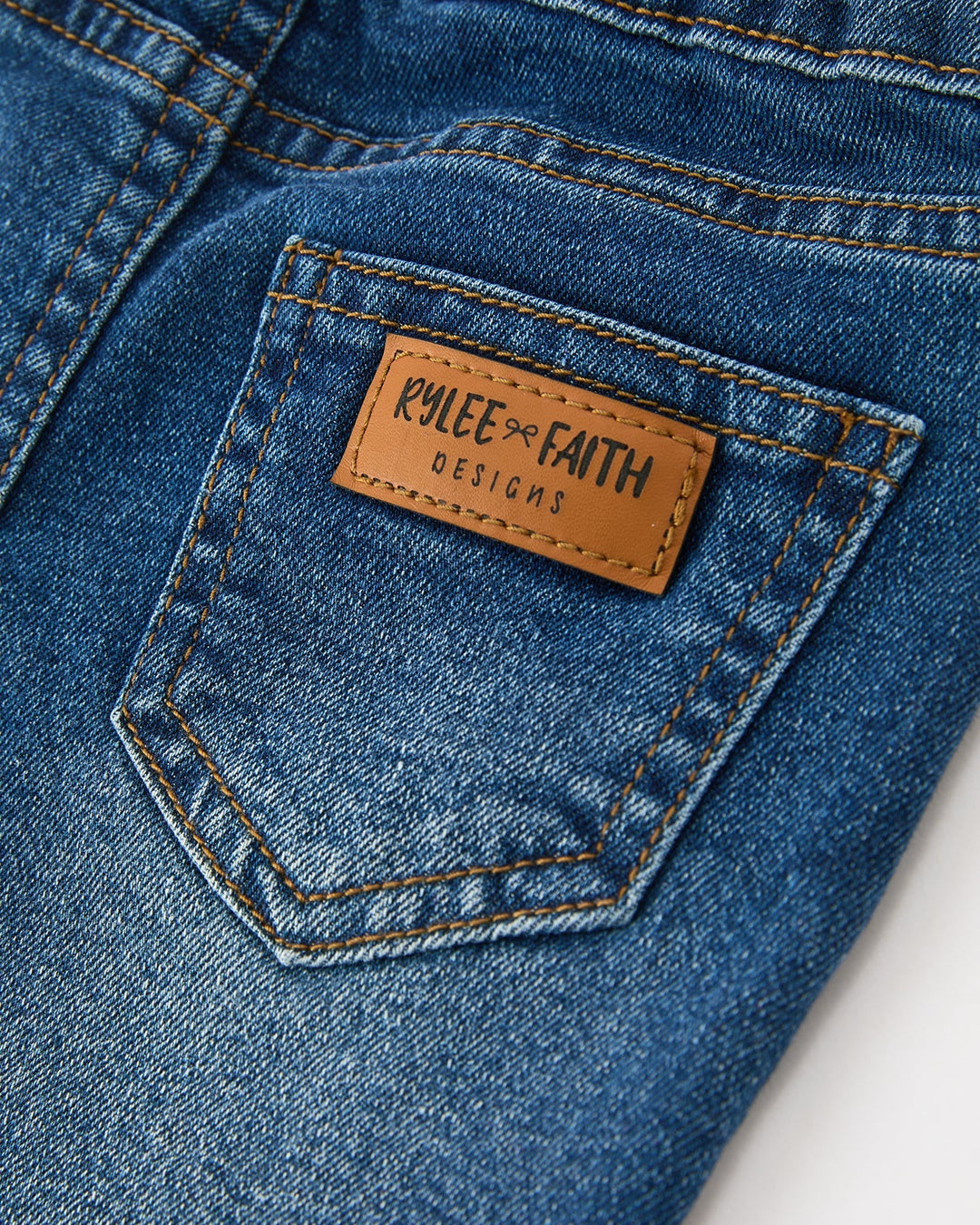 Girls denim jeans back pocket with leather brand patch label