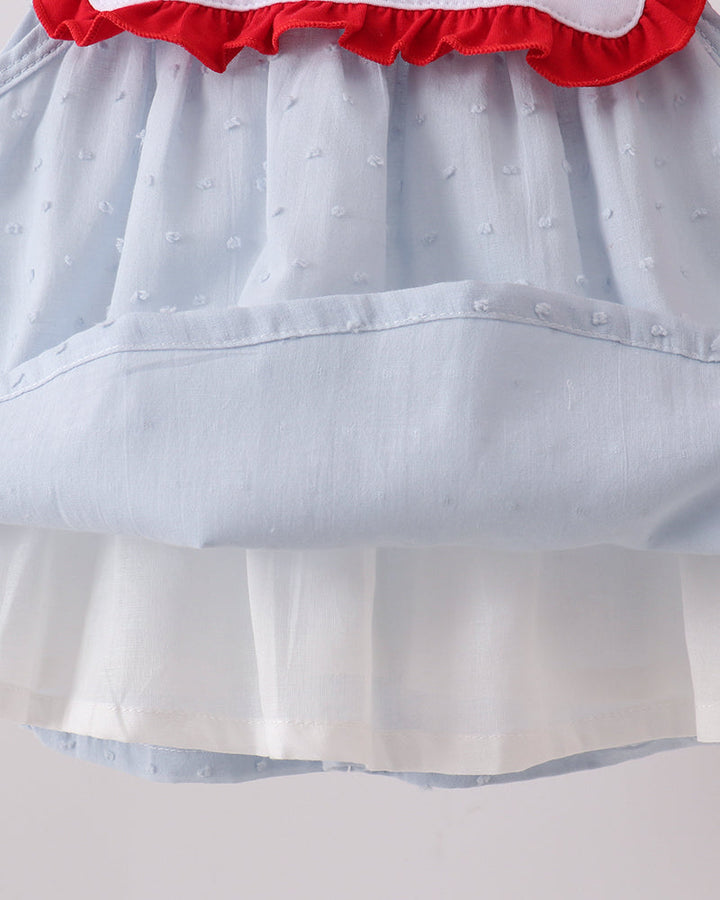Light blue swiss dot skirt with red ruffle trim and layered hem