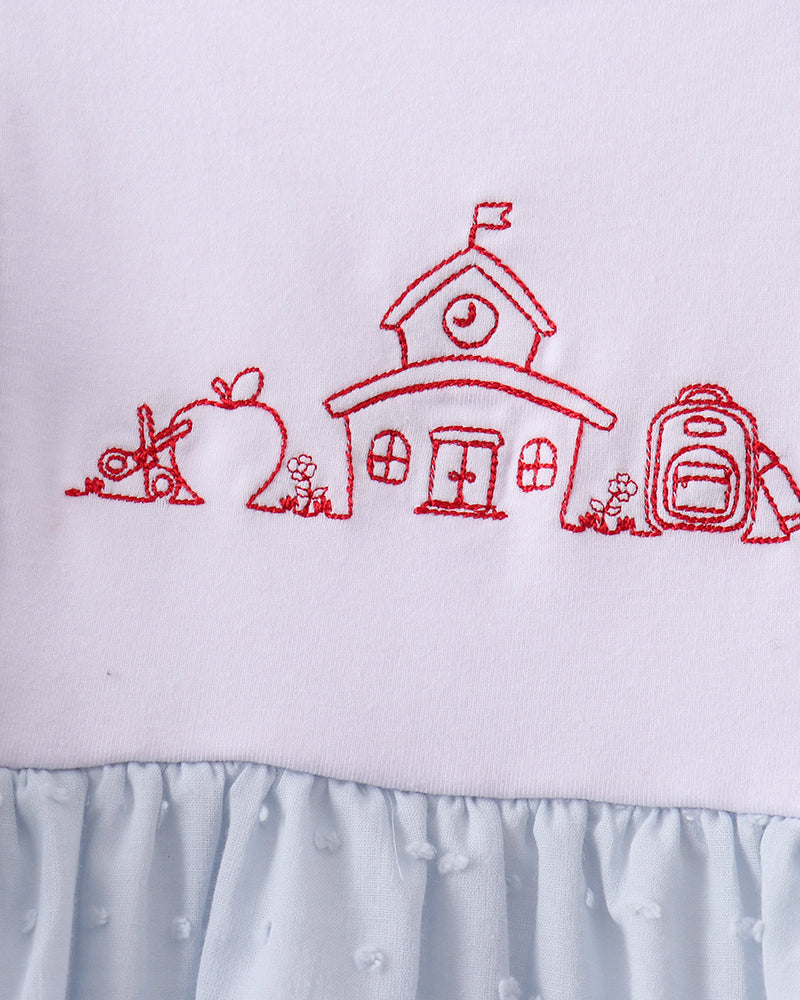 Light blue dress bodice with red house-style embroidery and ruffled collar
