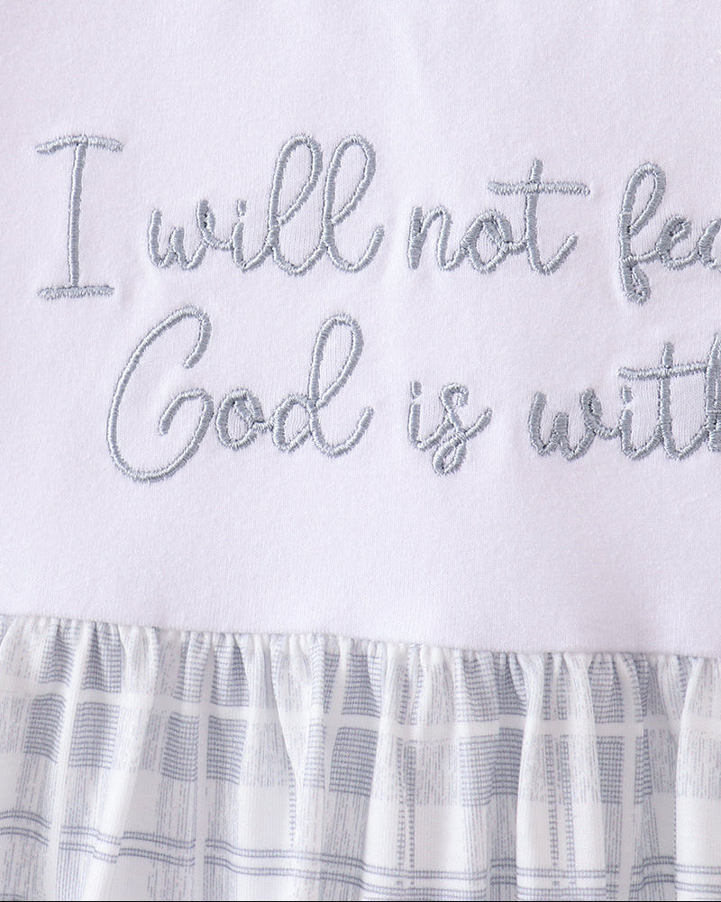 White dress bodice with light-gray embroidered quote and gingham ruffle hem
