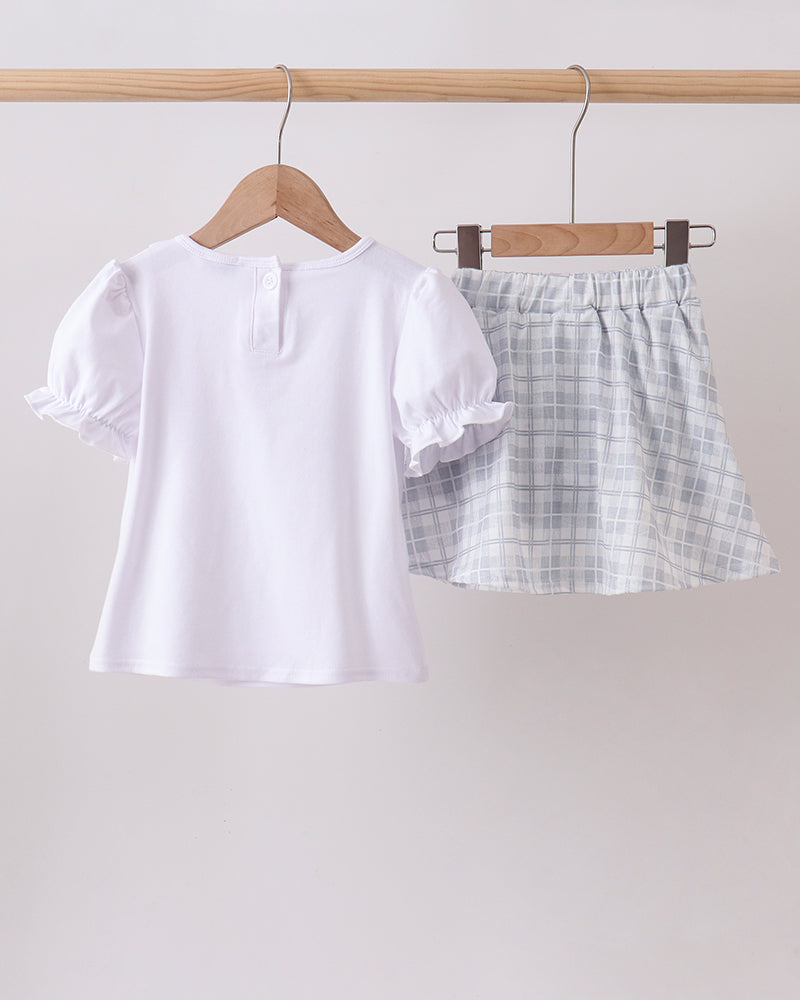 White ruffle top paired with light plaid ruffle shorts set