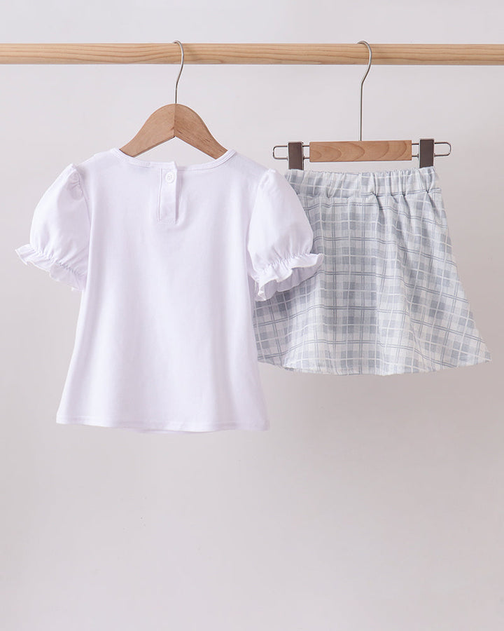 White ruffle top paired with light plaid ruffle shorts set