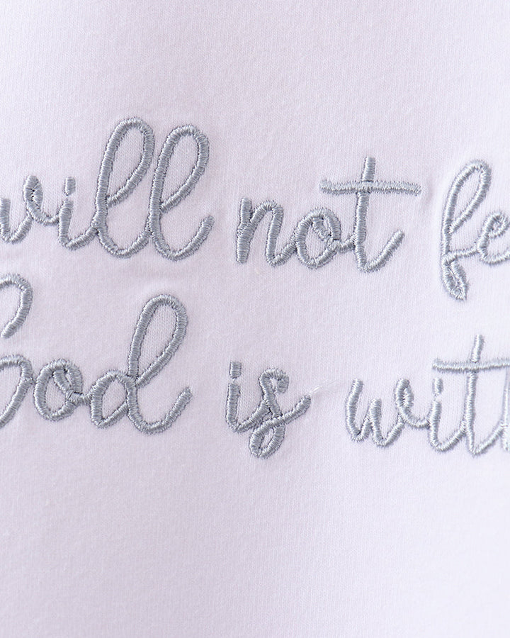 Faith quote embroidery on white T-shirt front in gray script