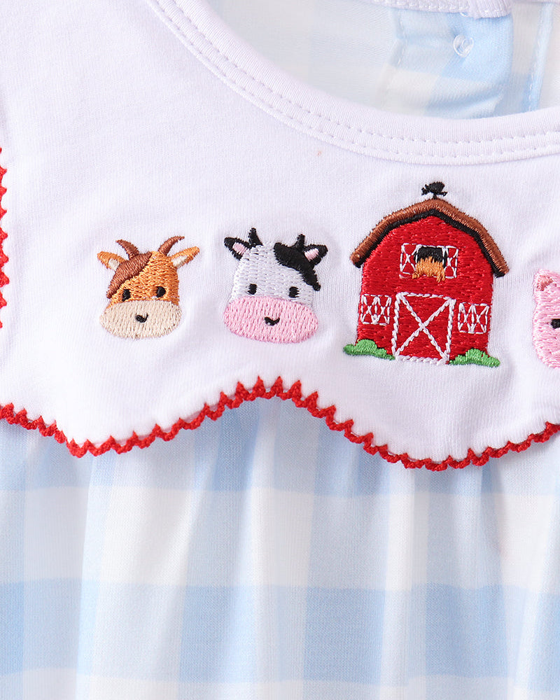 White-and-light-blue gingham dress yoke with farm animal embroidery and red trim