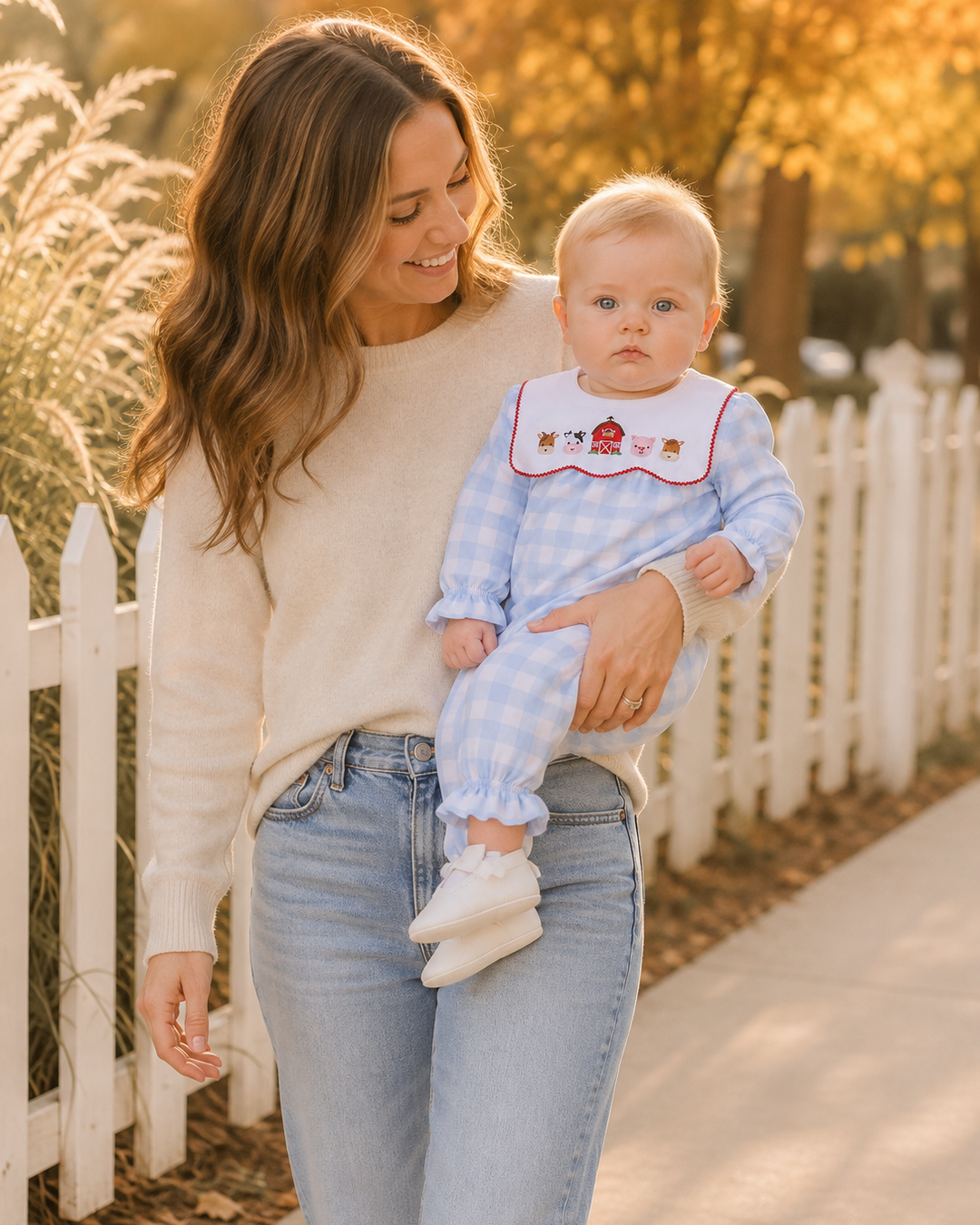 Light blue gingham baby romper with farm-animal print collar and gathered cuffs