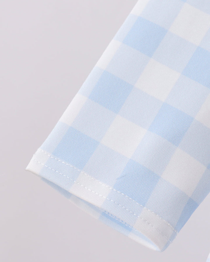 Light blue check gingham sleeve cuff with double-stitched hem