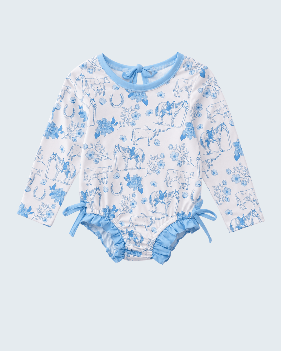 Baby rash guard with blue animal print on a light blue background