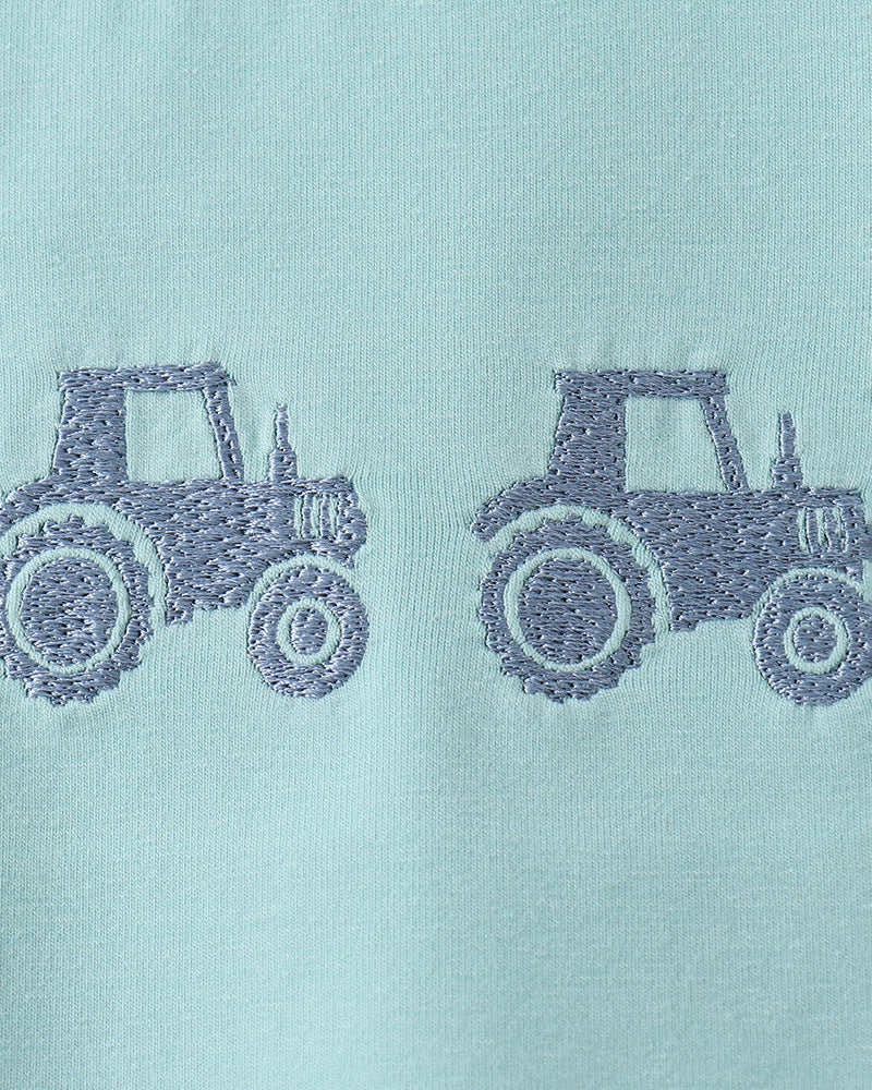 Tractor embroidery on blue shirt