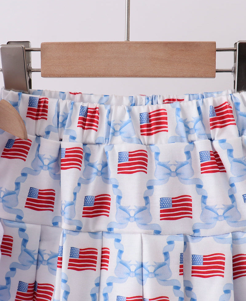 Skirt with American flag pattern on a hanger against a white background