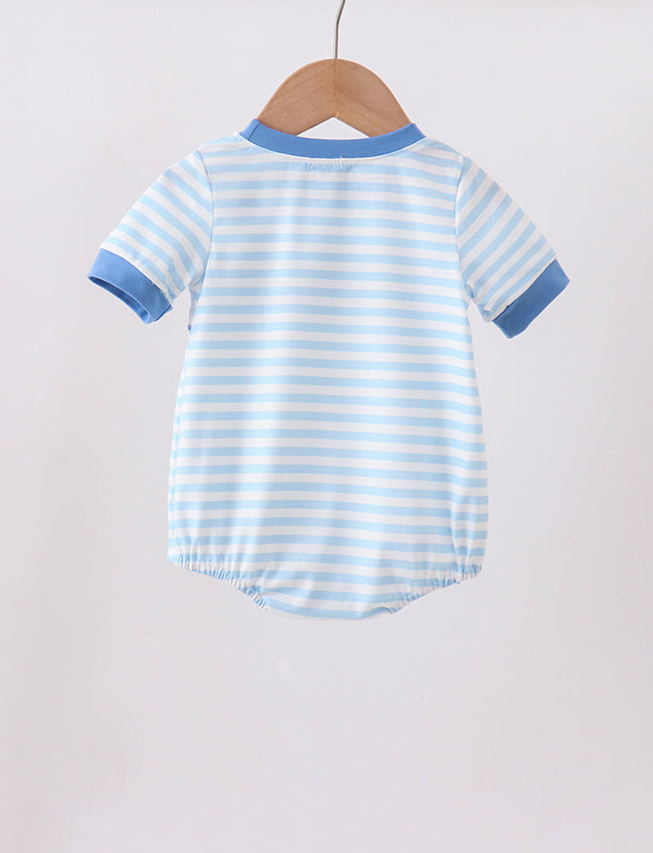 Blue and white striped baby romper on a wooden hanger against a light gray background