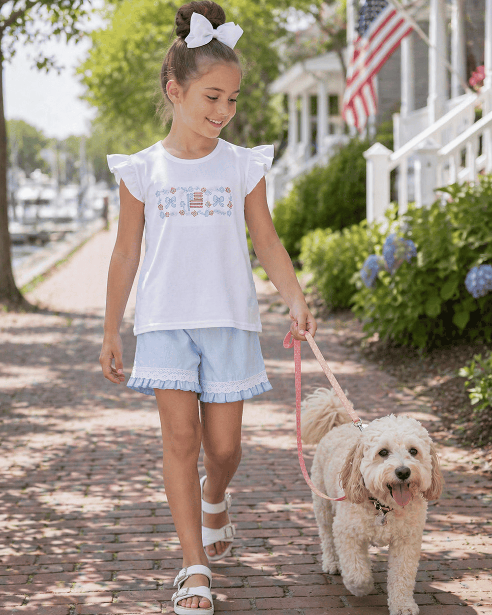 Young girl walking her dog
