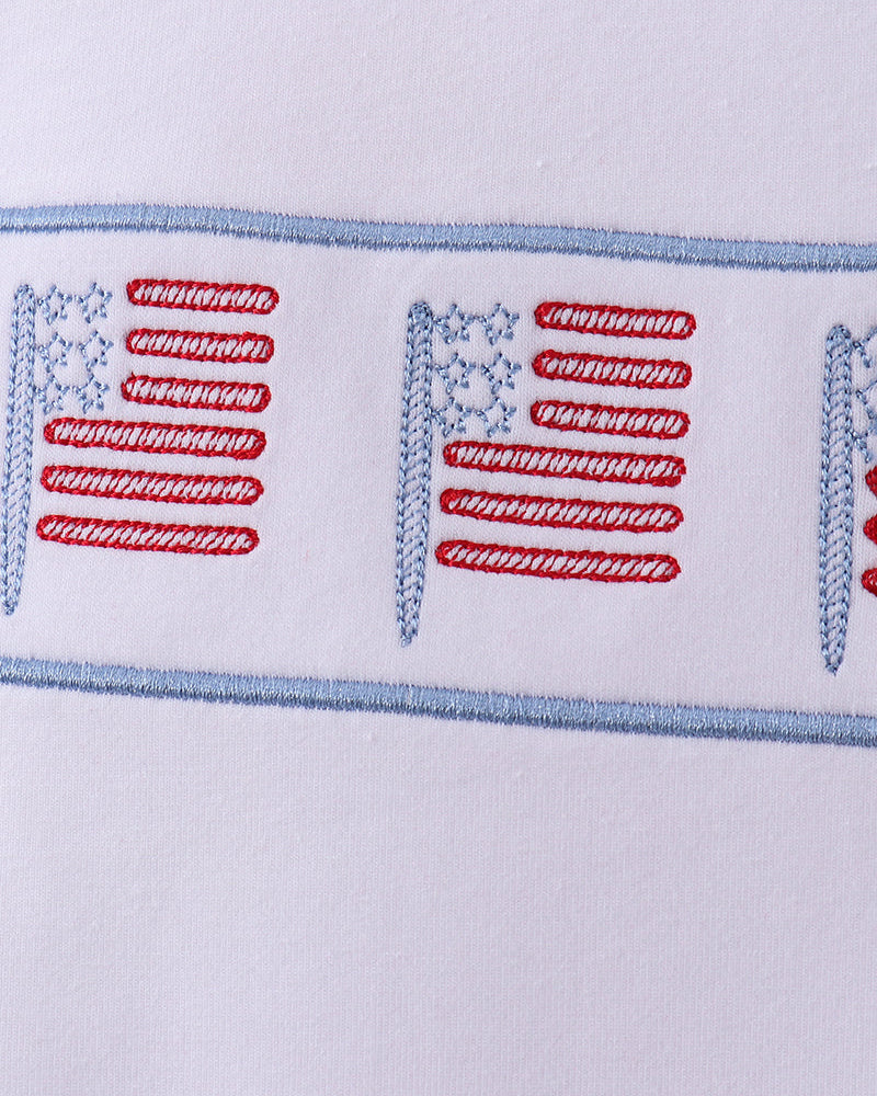 Embroidered American flag design on a white background