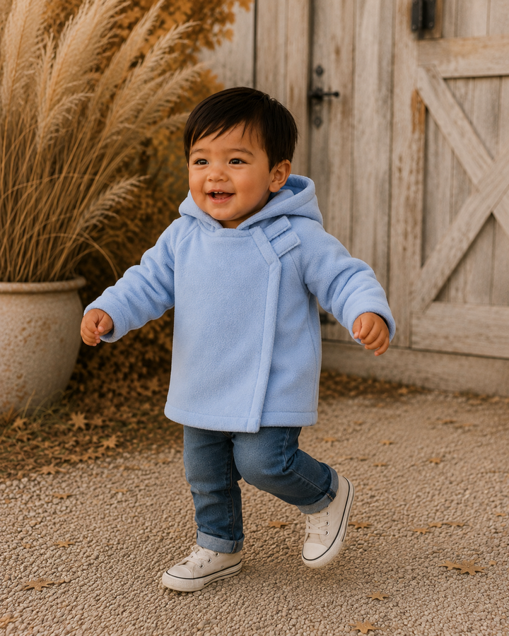 Light blue fleece hooded coat on child, front view