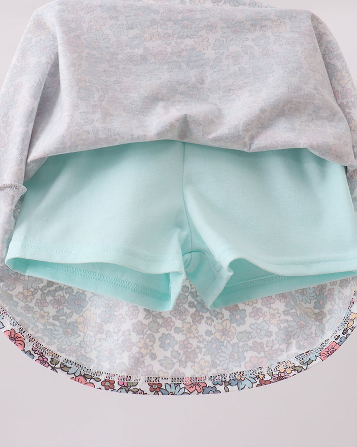 Mint blue skort with light floral waistband and long-sleeve top back