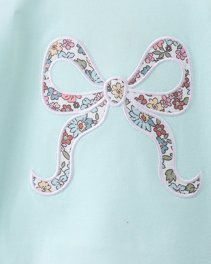 Mint blue shirt with embroidered floral bow applique and heart center