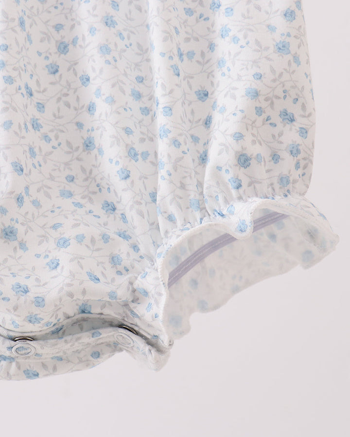 Floral-patterned fabric with blue flowers on a white background