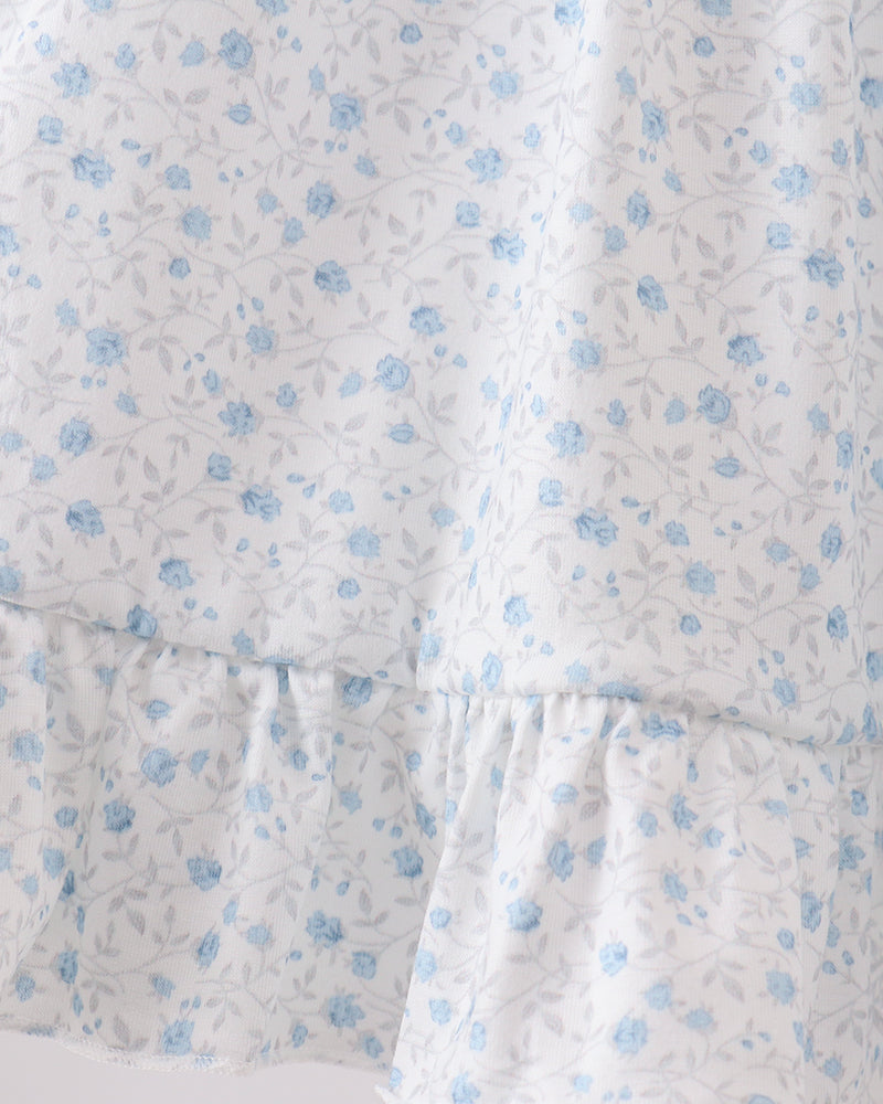 Floral patterned fabric with blue flowers on a white background