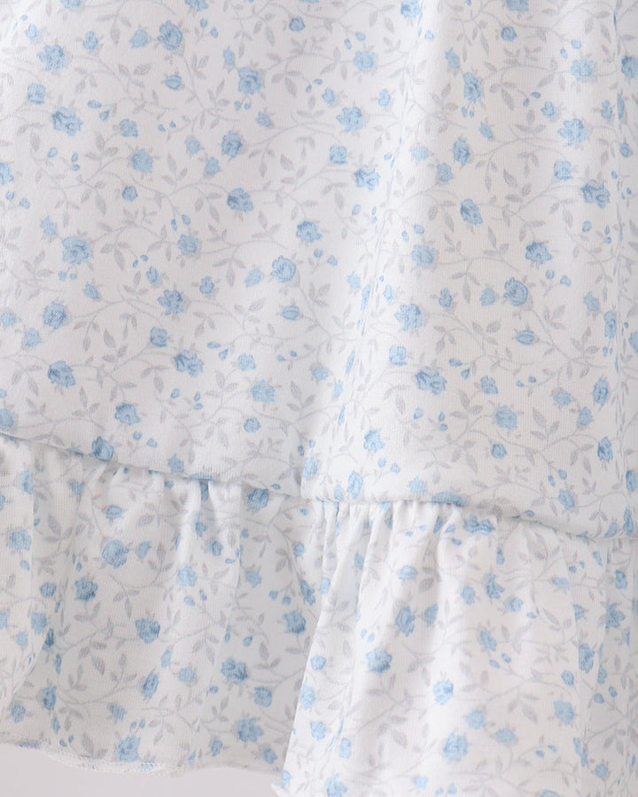 Floral patterned fabric with blue flowers on a white background