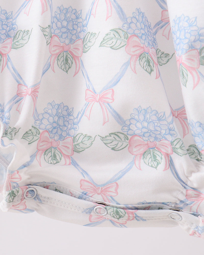 Fabric with floral and bow pattern on a white background