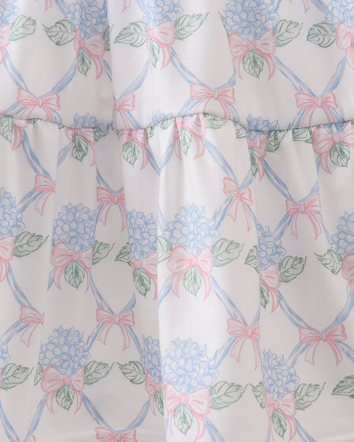 Floral and bow patterned fabric with a white background