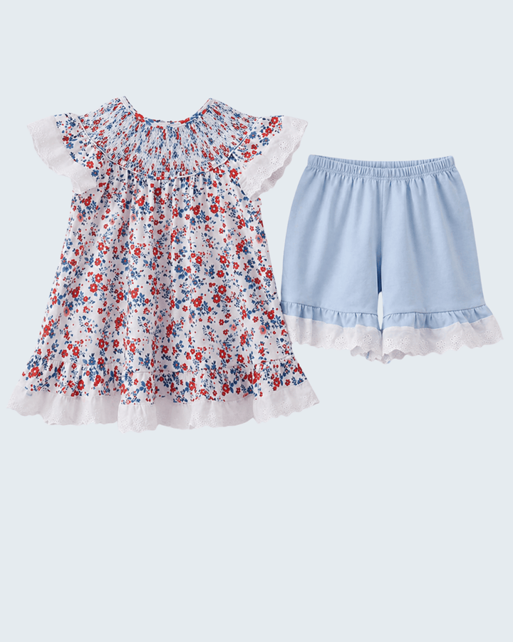 Floral dress and light blue shorts on a white background