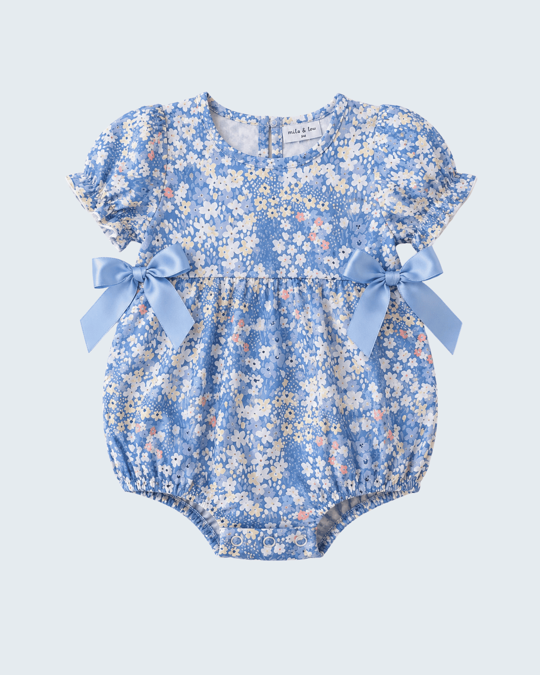 Blue floral print baby bubble romper with two satin bows at shoulders and round neck