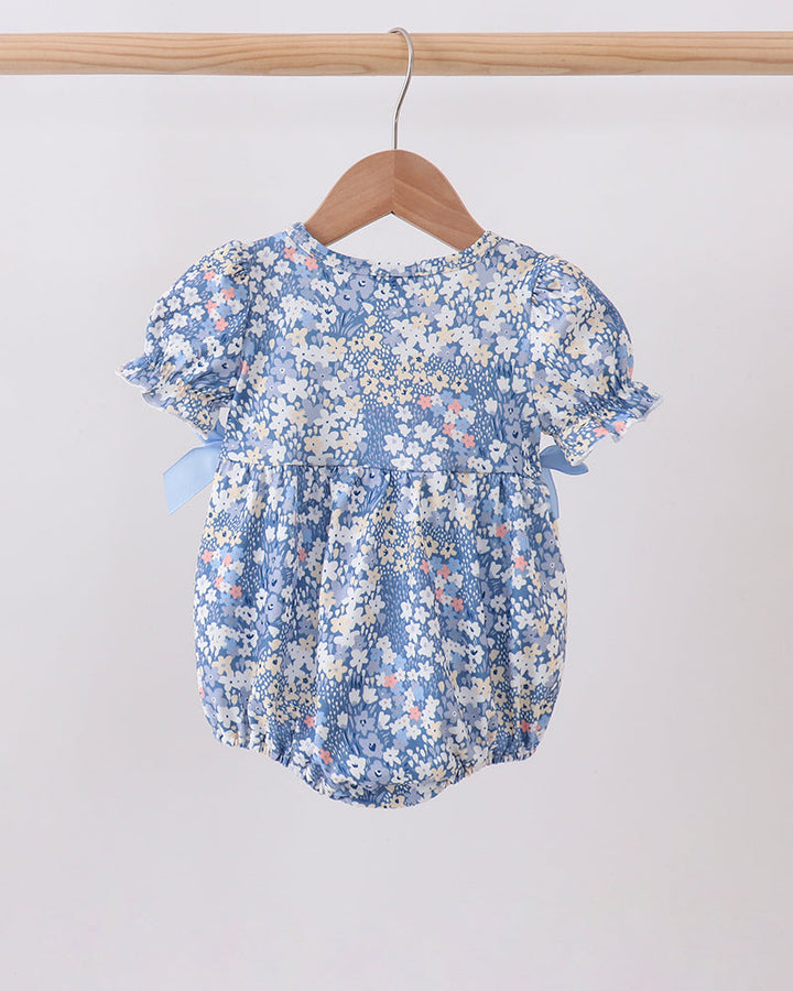 Blue floral print baby bubble romper with flutter sleeves, gathered waist, button leg snap