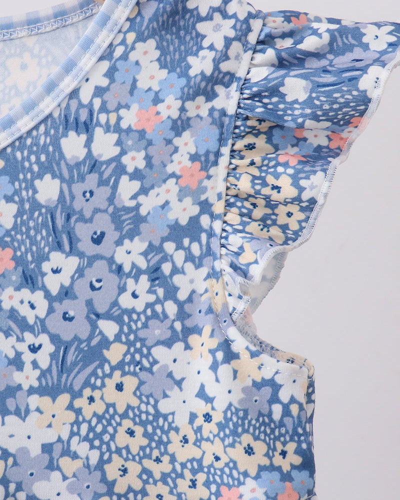 Blue floral dress close-up showing flutter sleeve ruffle and round neckline
