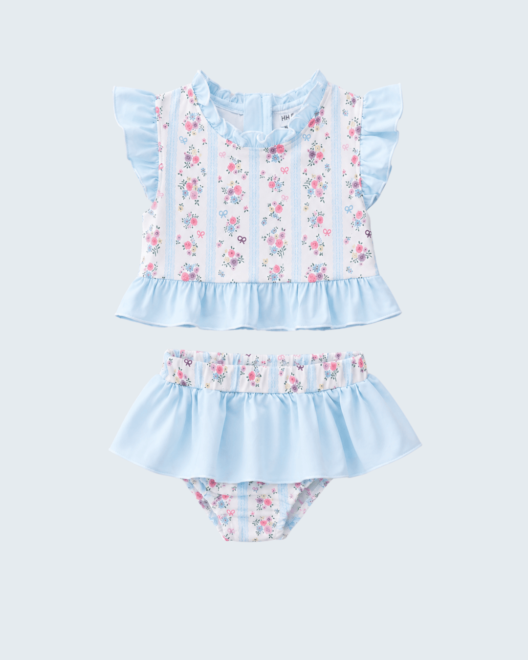Two piece swimsuits in blue and white flowers on light grey background.