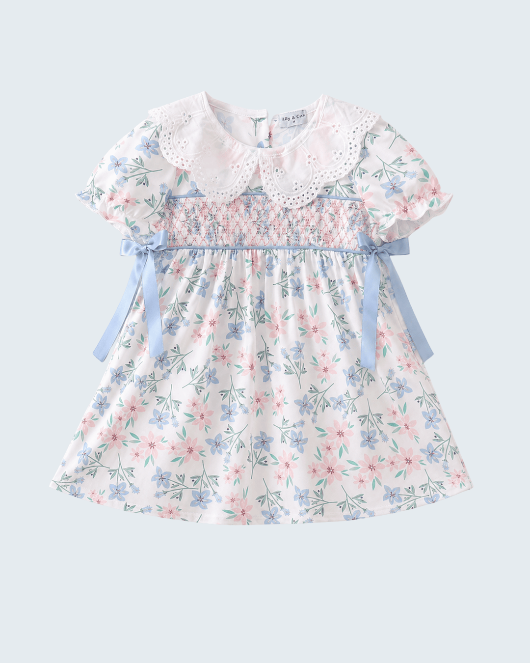 Floral dress with a white collar on a light gray background