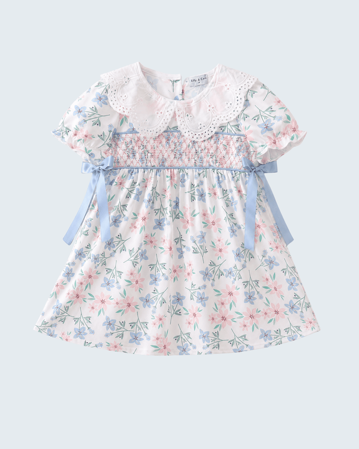Floral dress with a white collar on a light gray background