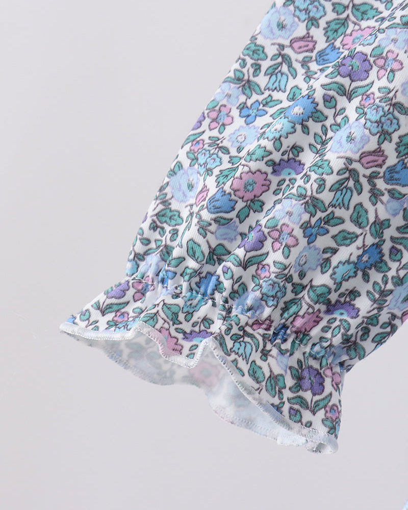 Light blue floral long sleeve with ruffle hem and gathered cuff