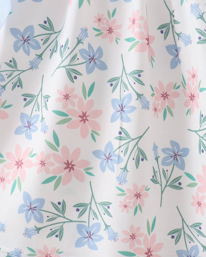 Floral pattern with pink, blue, and green flowers on a white background